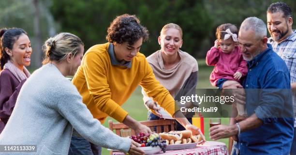 flera generationer spansktalande familj med bakgård cookout - large family bildbanksfoton och bilder