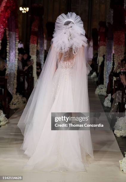 Model walks the runway wearing Reem Acra Bridal on April 11, 2019 in New York City.