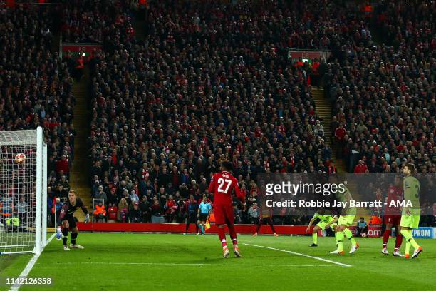 Divock Origi of Liverpool celebrates after scoring a goal to make it 4-0 during the UEFA Champions League Semi Final second leg match between...