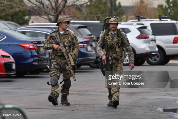 Officers patrol the scene of a shooting in which at least seven students were injured at the STEM School Highlands Ranch on May 7, 2019 in Highlands...
