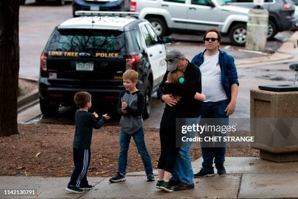 Students are evacuated from the Recreation Center at Northridge in Highlands Ranch after a shooting at the STEM School Highlands Ranch on May 7,...