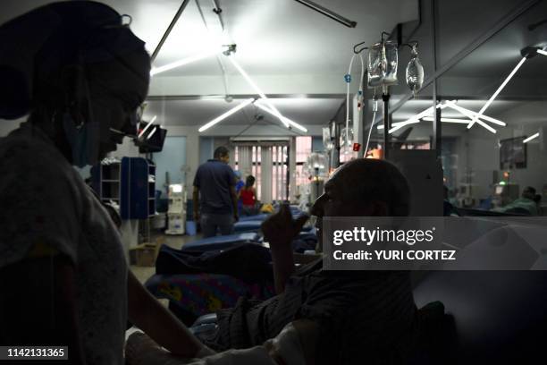 Patients suffering from renal failure receive hemodialysis treatment at a clinic in Barquisimeto, Venezuela, on April 24, 2019. - For cronic patients...