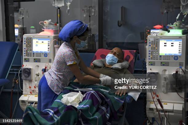 Patient suffering from renal failure receives hemodialysis treatment at a clinic in Barquisimeto, Venezuela, on April 24, 2019. - For cronic patients...