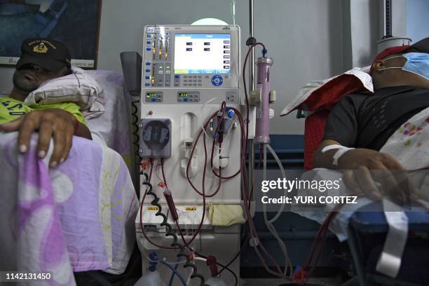 Patients suffering from renal failure receive hemodialysis treatment at a clinic in Barquisimeto, Venezuela, on April 24, 2019. - For cronic patients...