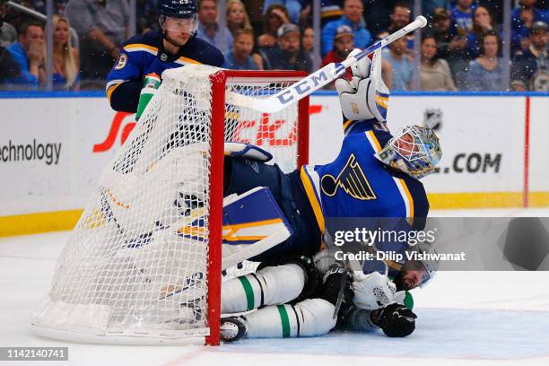 Alexander Radulov of the Dallas Stars crashes into Jordan Binnington of the St. Louis Blues after taking a shot on goal in Game Seven of the Western...