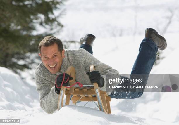 Man Riding Sled Man Sledding Photos and Premium High Res Pictures - Getty Images