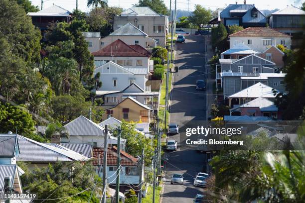 Residential properties stand along a street in Brisbane, Australia, on Tuesday, May 7, 2019. Australian central bank chief Philip Lowe dashed...