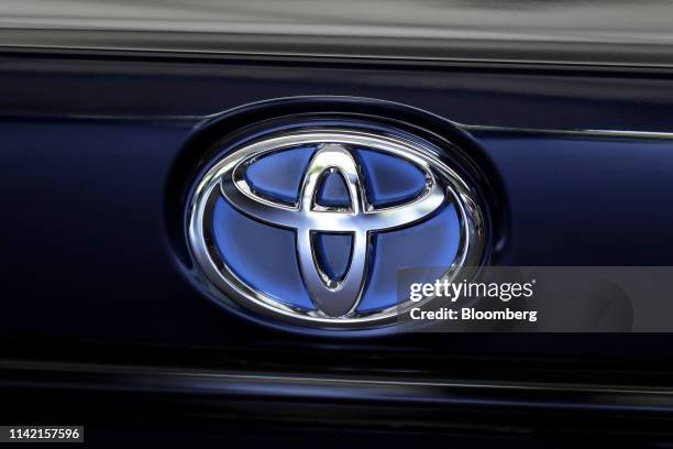 The Toyota Motor Corp. Badge is seen on the company's Corolla Sedan Hybrid on display at the company's offices in Tokyo, Japan, on Wednesday, May 8,...