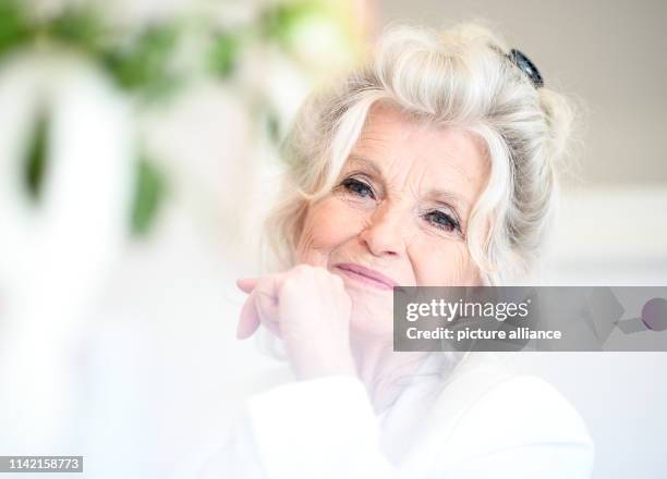 April 2019, Berlin: EXCLUSIVE - Helga Piur, actress, sits in the dining room. Photo: Britta Pedersen/dpa-Zentralbild/ZB