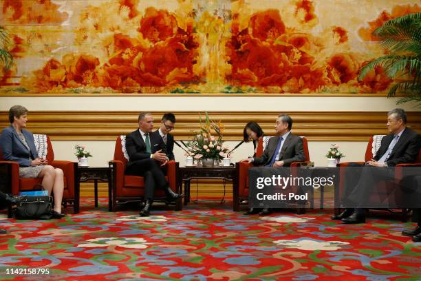 Chinese Foreign Minister Wang Yi and Britain's National Security Adviser Mark Sedwill attend a meeting at Zhongnanhai leadership compound on May 8,...