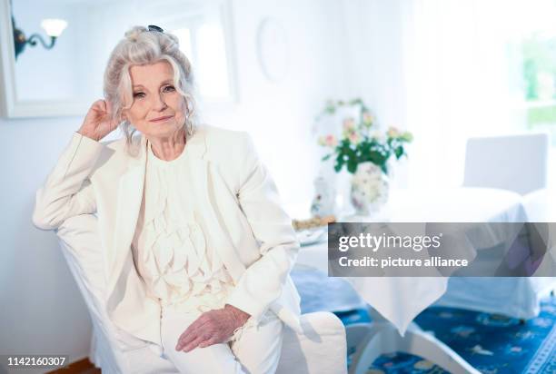 April 2019, Berlin: EXCLUSIVE - Helga Piur, actress, sits in her dining room. Photo: Britta Pedersen/dpa-Zentralbild/ZB