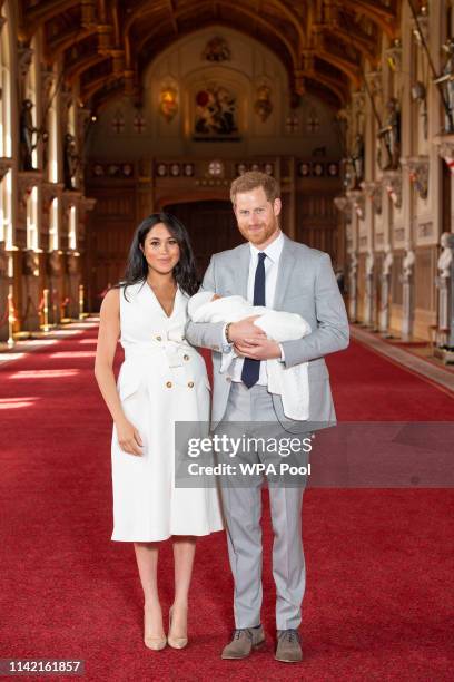 Prince Harry, Duke of Sussex and Meghan, Duchess of Sussex, pose with their newborn son Archie Harrison Mountbatten-Windsor during a photocall in St...