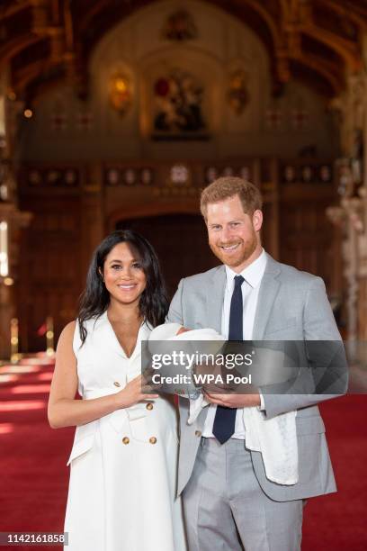 Prince Harry, Duke of Sussex and Meghan, Duchess of Sussex, pose with their newborn son Archie Harrison Mountbatten-Windsor during a photocall in St...