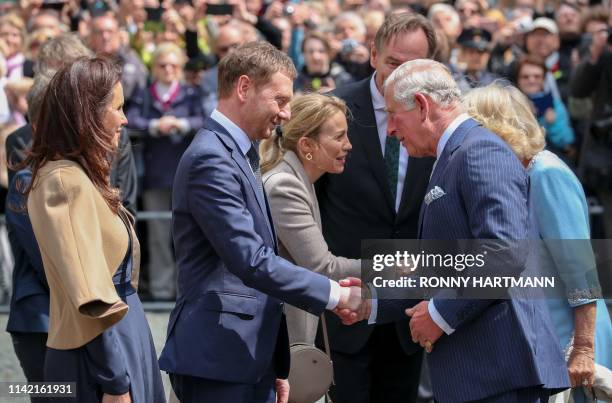 Britain's Prince Charles, Prince of Wales and his wife Britain's Camilla, Duchess of Cornwall are welcomed by Saxony's Prime Minister Michael...