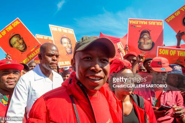 Economic Freedom Fighters party leader Julius Malema walks away after casting his vote at a polling station in the Sheshego township on the outskirts...