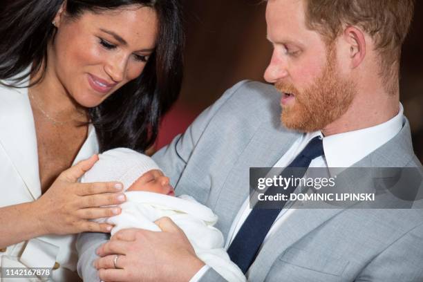 Britain's Prince Harry, Duke of Sussex , and his wife Meghan, Duchess of Sussex, pose for a photo with their newborn baby son, Archie Harrison...