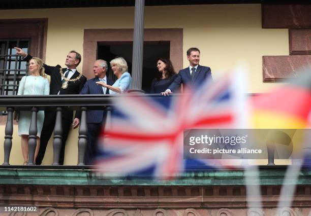 May 2019, Saxony, Leipzig: The British heir to the throne Prince Charles and his wife Camilla stand with Burkhard Jung , mayor of Leipzig and his...