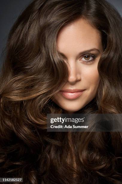 woman with beautiful curly hair - wavy brown hair stock pictures, royalty-free photos & images