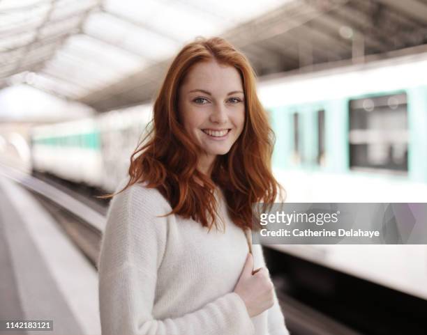 portrait of a young woman in the subway in paris - subway paris stock-fotos und bilder