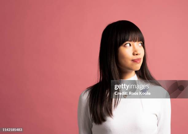 asian girl - portrait young colour background cool stockfoto's en -beelden