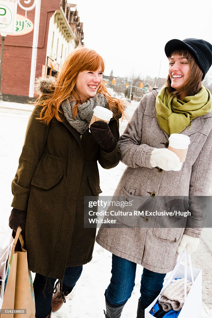 Women shopping on snowy street