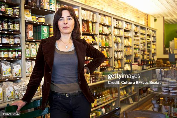 portrait of woman in her shop - pyrenees stock-fotos und bilder