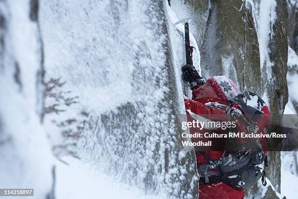 male climber in winter - pickaxe stock pictures, royalty-free photos & images