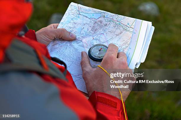 compass and map - north wales map stock pictures, royalty-free photos & images