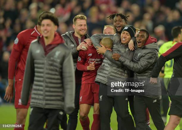 Roberto Firmino of FC Liverpool and Divock Origi of FC Liverpool celebrate after the UEFA Champions League Semi Final second leg match between...
