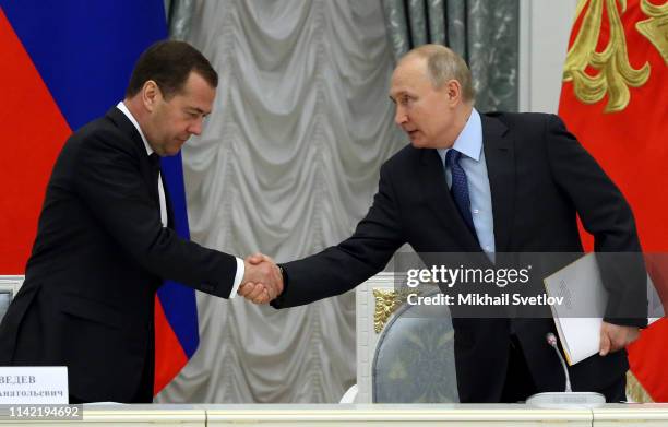 Russian President Vladimir Putin greets Prime Minister Dmitry Medvedev during the Council on National Projects at the Kremlin on May 8, 2019 in...