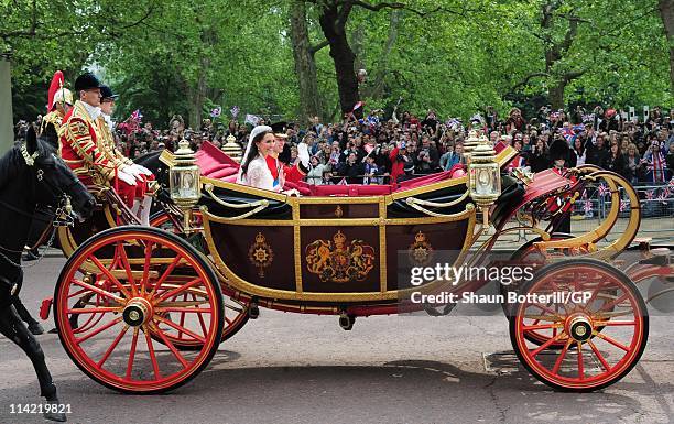 Prince William, Duke of Cambridge and Catherine, Duchess of Cambridge make the journey by carriage procession to Buckingham Palace following their...