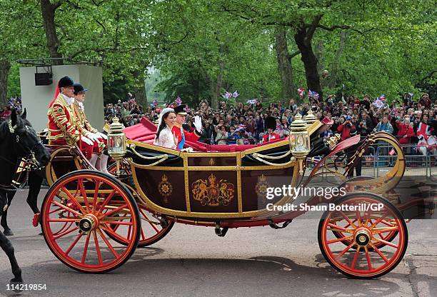 Prince William, Duke of Cambridge and Catherine, Duchess of Cambridge make the journey by carriage procession to Buckingham Palace following their...