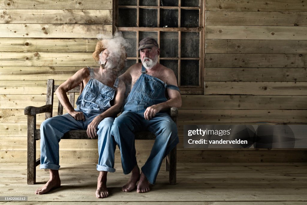 Two elderly Hillbillies gossiping
