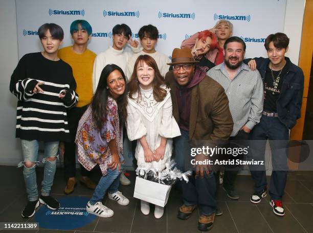 SiriusXM hosts Nicole Ryan, Min Suh, Stanley T., and Ryan Sampson pose with South Korean group BTS while visiting 'The Morning Mash Up' On SiriusXM...