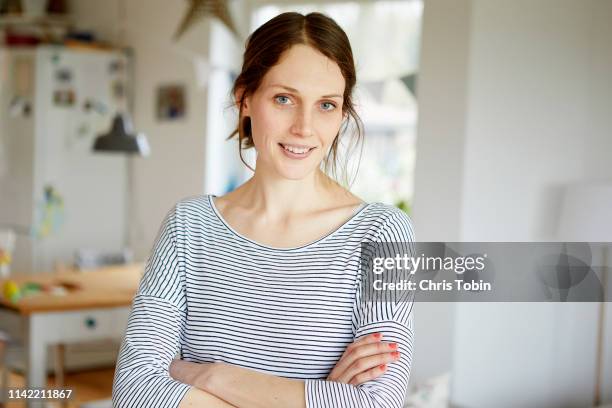 portrait of woman at home - portrait home stock-fotos und bilder