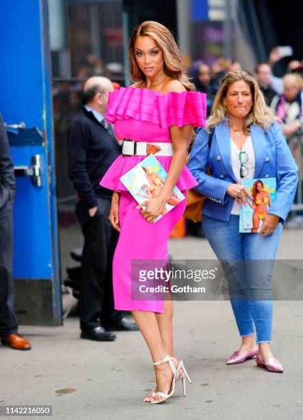 Tyra Banks is seen wearing a fuchsia dress on May 8, 2019 in New York City.