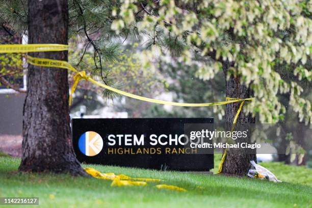 Bouquet of flowers is left next to the entrance to the STEM School Highlands Ranch on May 8, 2019 in Highlands Ranch, Colorado one day after two...