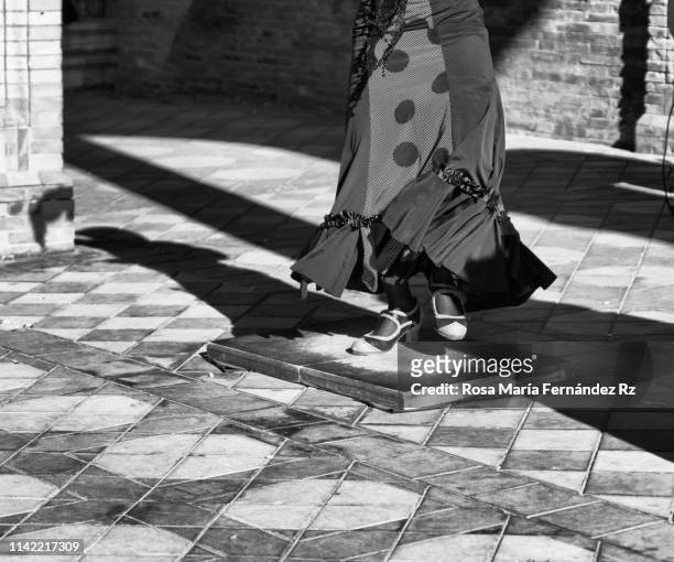 low section view of woman (flamenco dancer) tap dancing in street, sevilla, andalusia, spain - flounced skirt stock pictures, royalty-free photos & images