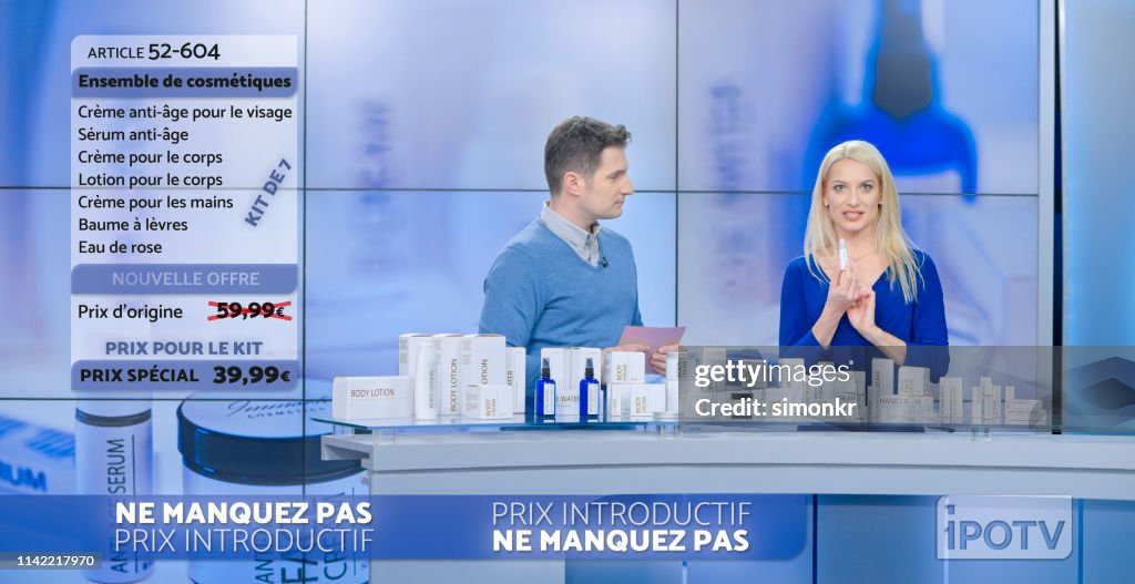 Salesman and saleswoman marketing cosmetic products