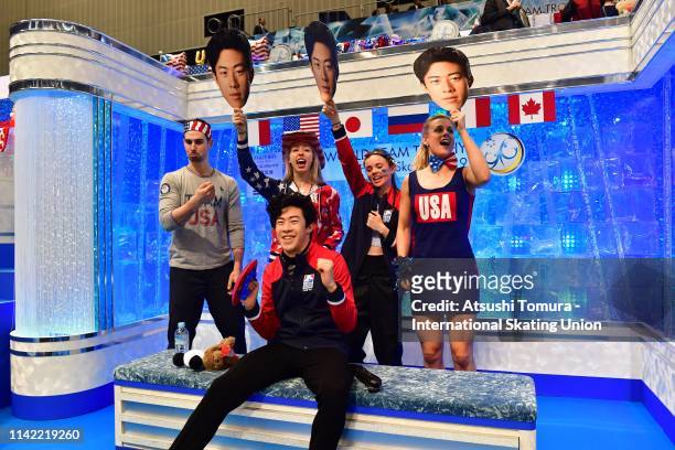 Nathan Chen of the United States celebrates after his score was announced at the kiss and cry with his team matesafter competing in the Men's Single...