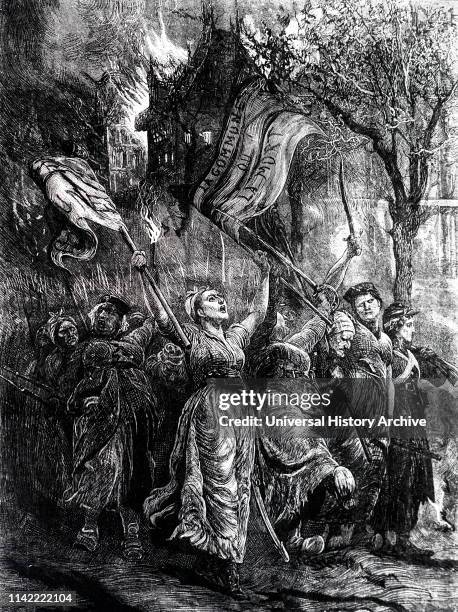 An engraving depicting the Paris Commune - Female Comrades marching to defend a barricade in Montmartre carrying two large red flags and shouting the...