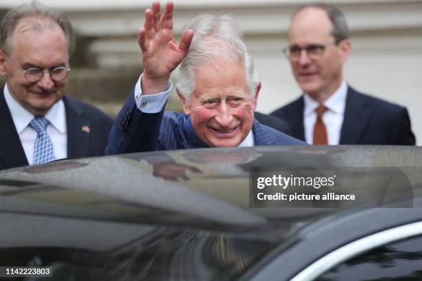 May 2019, Saxony-Anhalt, Wörlitz: The British heir to the throne Prince Charles waves to the visitors in the Garden Kingdom Dessau-Wörlitz next to...