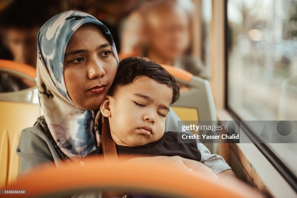 Mother and Toddler Son in a Bus