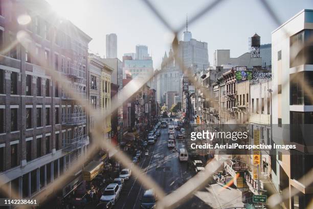 high angle view of chinatown from manhattan bridge - lower east side manhattan stock pictures, royalty-free photos & images