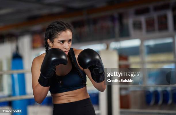 teenage girl training in boxing ring - ring girl boxing stock pictures, royalty-free photos & images