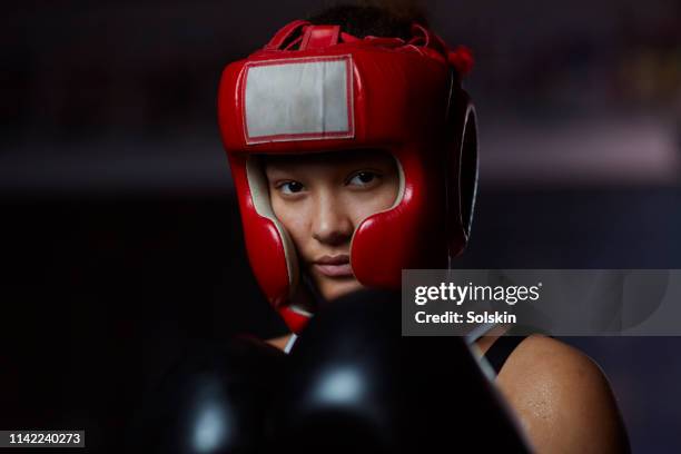 portrait of teenage athletic boxing girl - head protector stock pictures, royalty-free photos & images