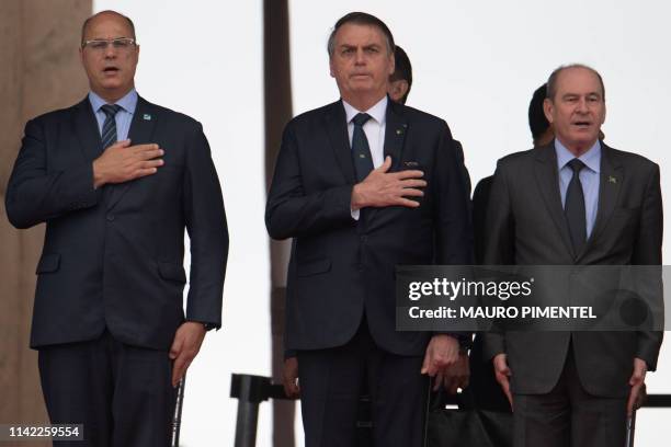 Rio de Janeiro's Governor Wilson Witzel , Brazilian President Jair Bolsonaro and Brazilian Defense Minister Fernando Azevedo e Silva attend a...