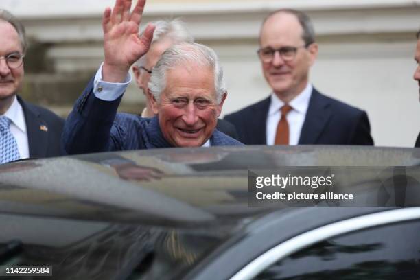 May 2019, Saxony-Anhalt, Wörlitz: The British heir to the throne Prince Charles waves to the visitors in the Garden Kingdom Dessau-Wörlitz next to...