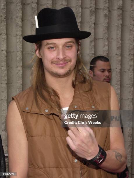 Music recording artist Kid Rock flips off the photograher as he arrives at the world premiere of the film "Joe Dirt" by Columbia Pictures April 1,...