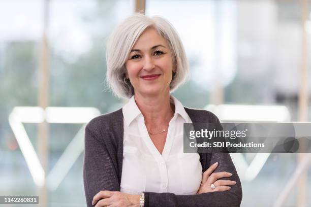 the school district supervisor in her office - lovely professional university stock pictures, royalty-free photos & images